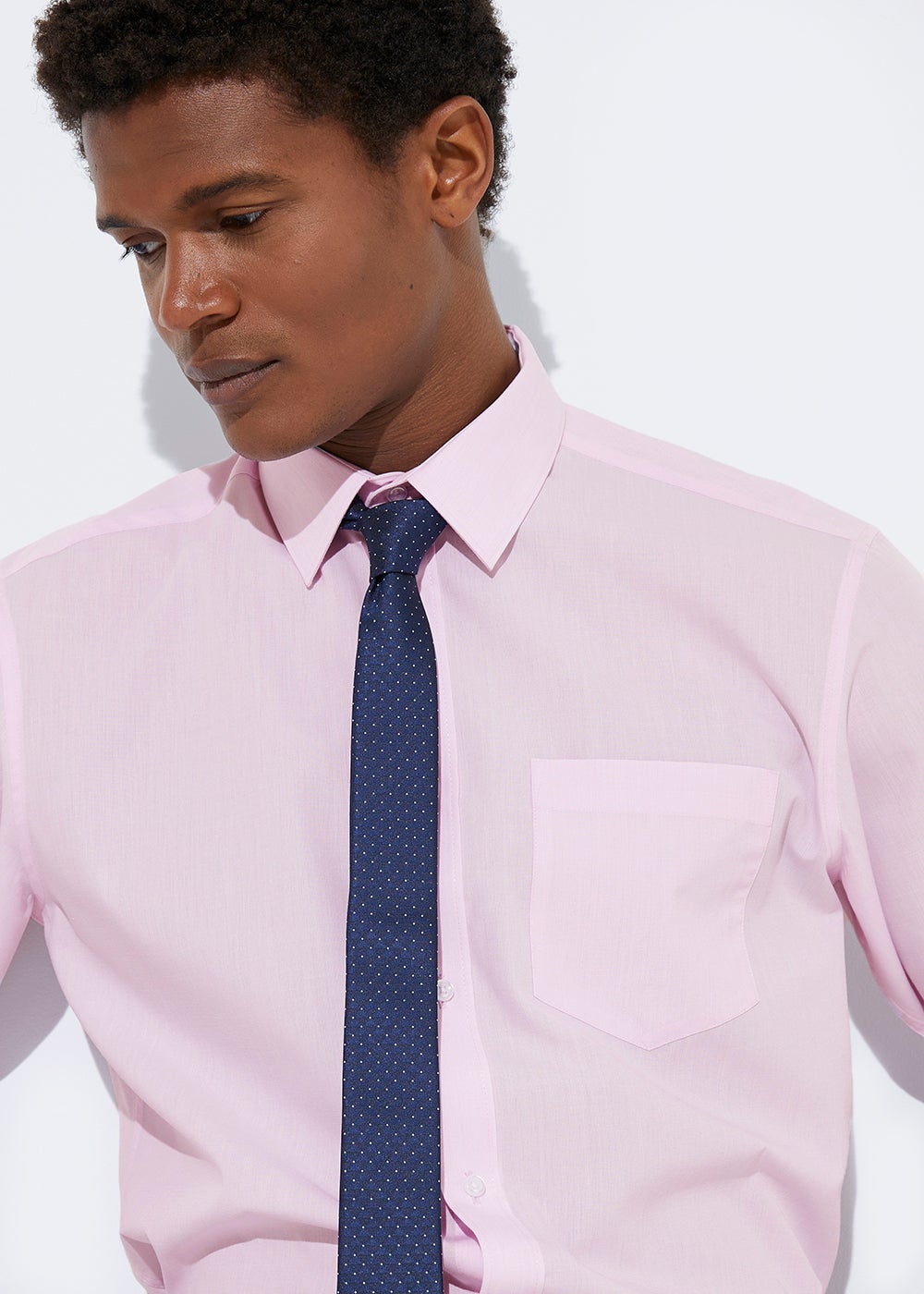 black shirt with pink tie