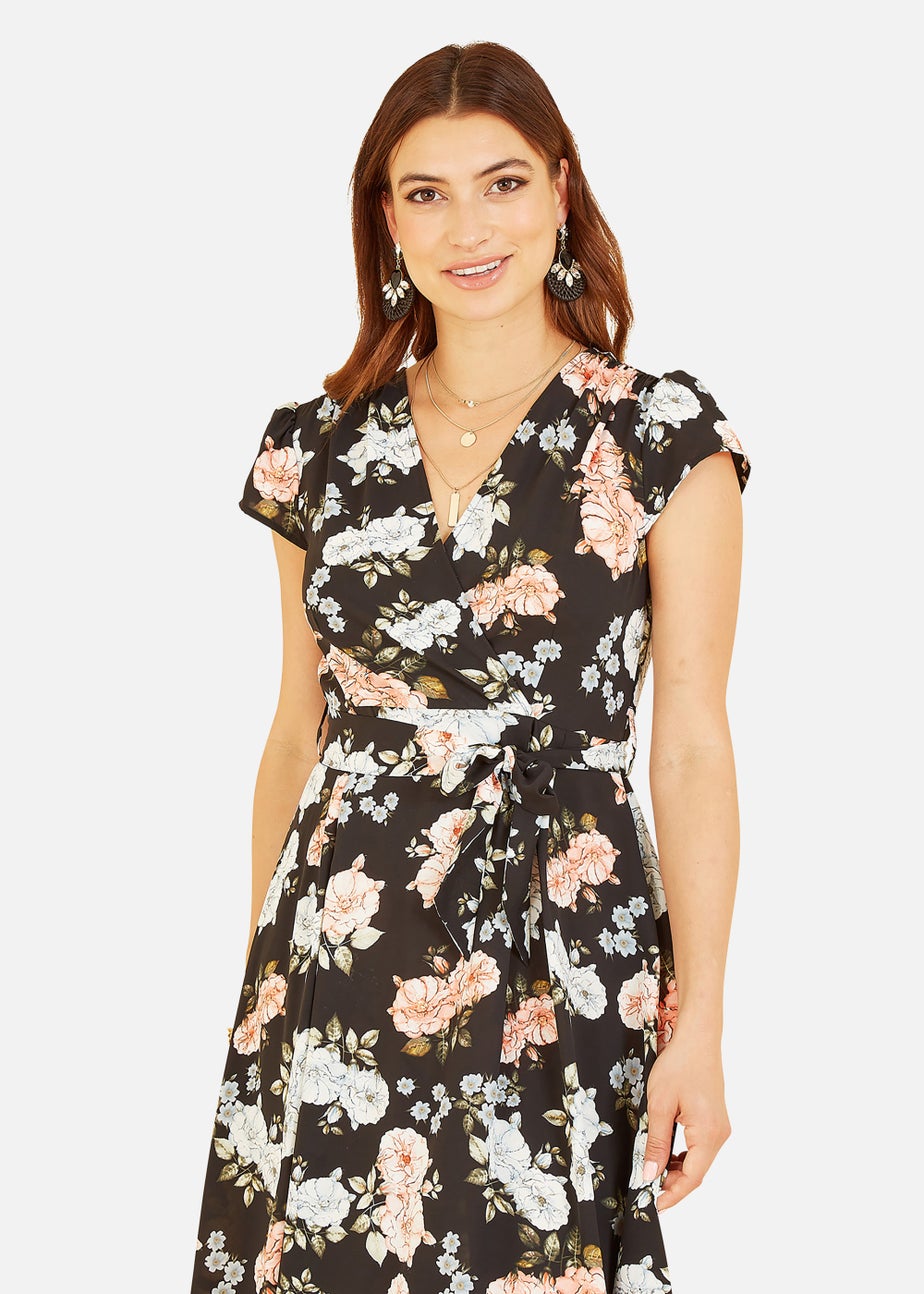 Mela Floral Print Dipped Hem Wrap Dress In Black