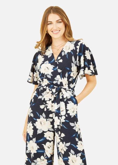 Mela Floral Print Jumpsuit With Angel Sleeves In Navy