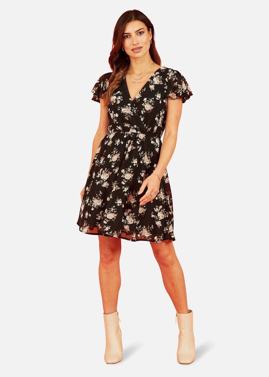 Mela Floral Print Wrap Over Skater Dress In Black