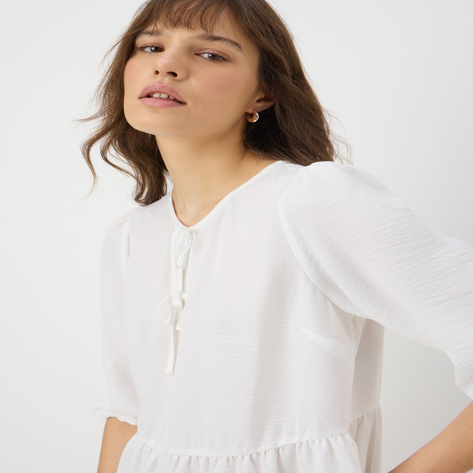 Ivory Tie Neck Peplum Blouse