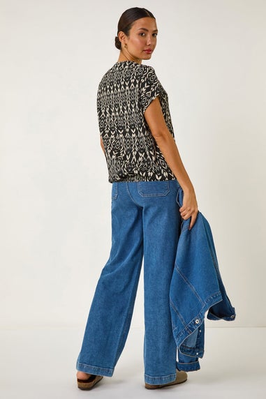Roman Black Geometric Ikat Print Bubble Hem Top