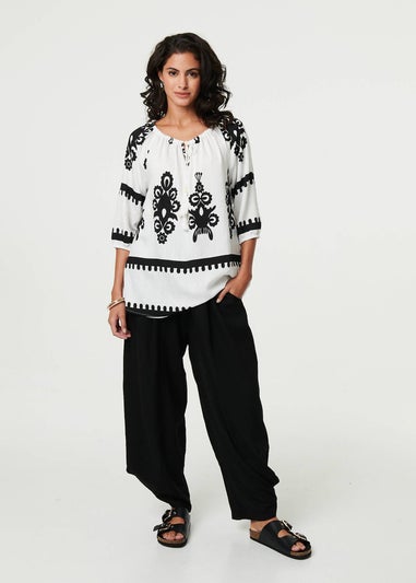 Izabel London White Ikat Print Tassel Tie Neck Blouse