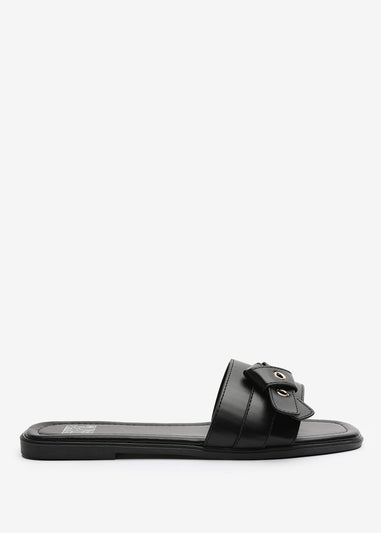 Where's That From Lucy Black Slip-On Sandals with Buckle Accent