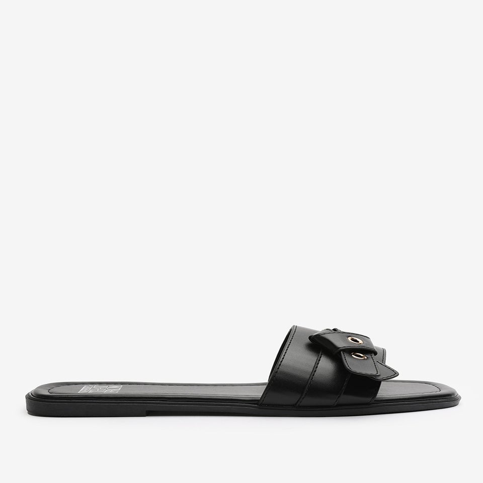 Where's That From Lucy Black Slip-On Sandals with Buckle Accent