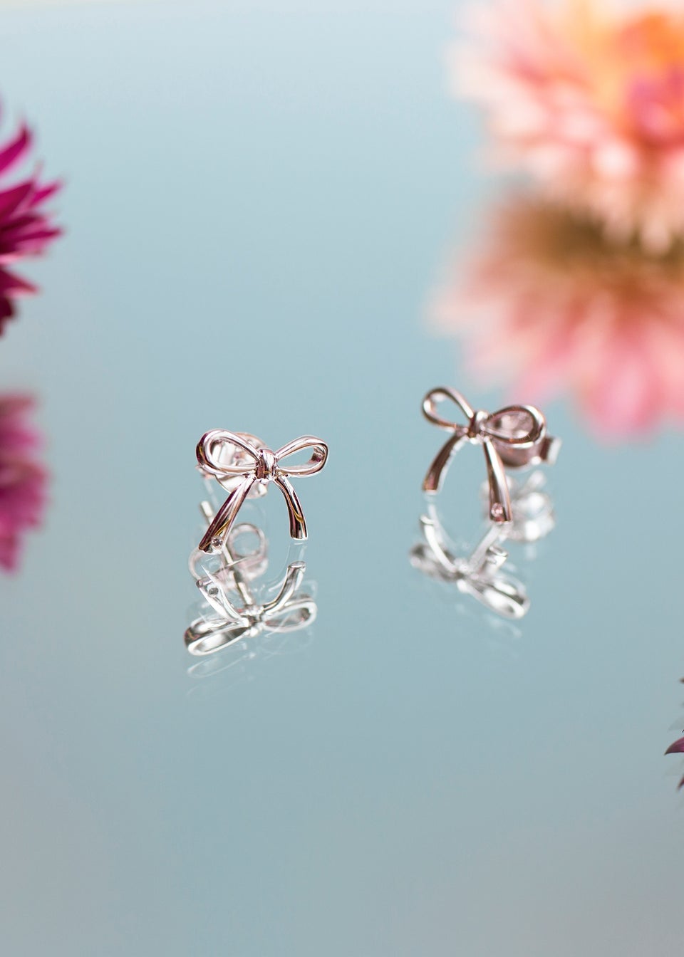 Golden Moments Sterling Silver Bow with 0.003ct Round White Diamond Stud Earrings