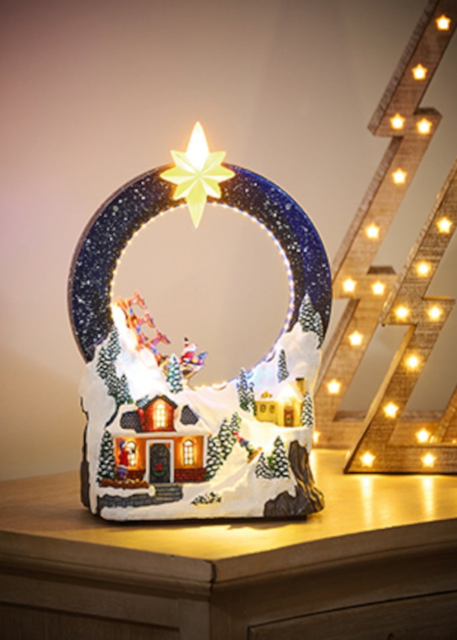 Premier Decorations Battery Operated Lit Village with Looping Santa Sleigh