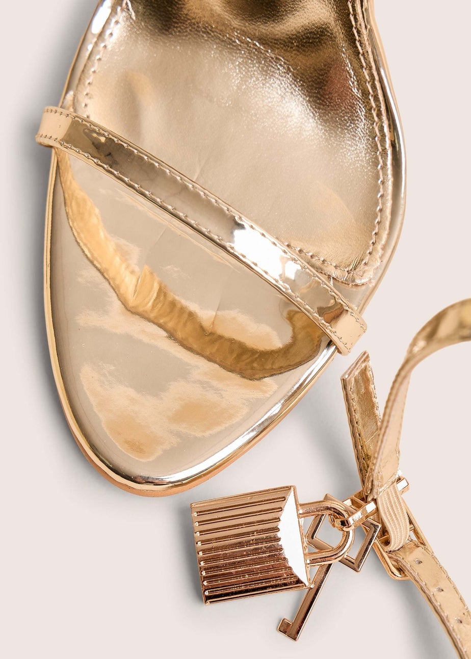 Public Desire Ti Amo Gold Wide Fit Metallic PU Padlock Detail Barely There Pointed Toe Stilettos Heels