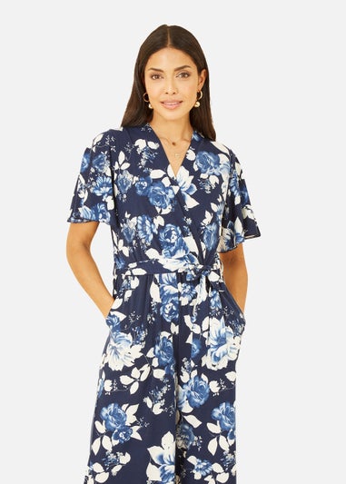 Mela Rose Print Jumpsuit With Angel Sleeves In Navy