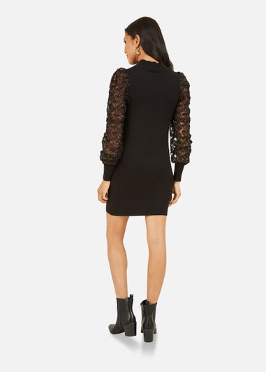 Mela Fitted Knitted Dress With Mesh Sleeve In Black