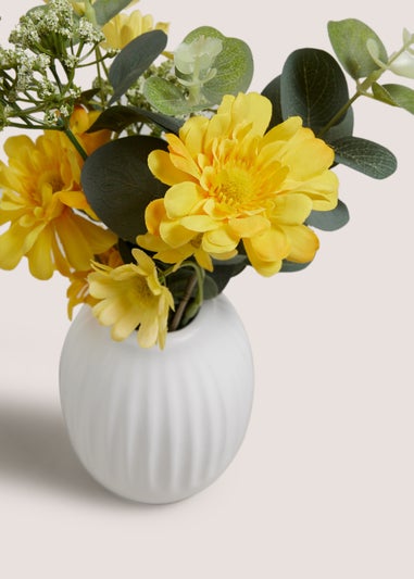 Yellow Flowers In A Rib Vase