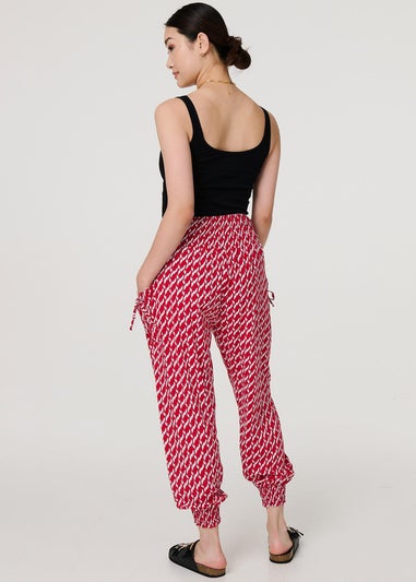 Izabel London Red Printed Tapered Harem Trousers