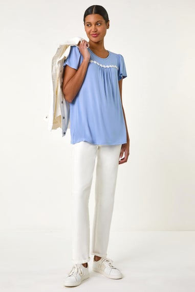 Roman Light Blue Daisy Trim Stretch Top
