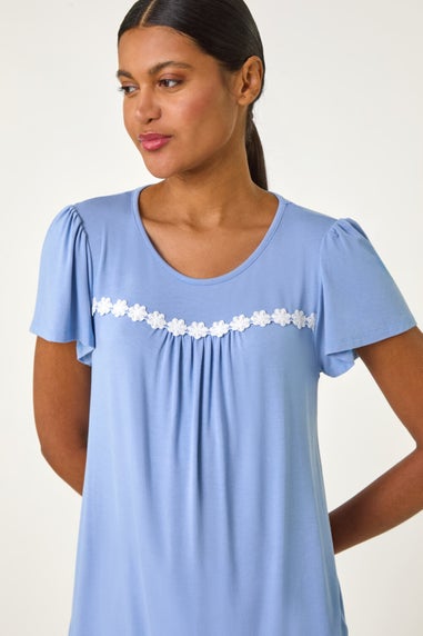 Roman Light Blue Daisy Trim Stretch Top