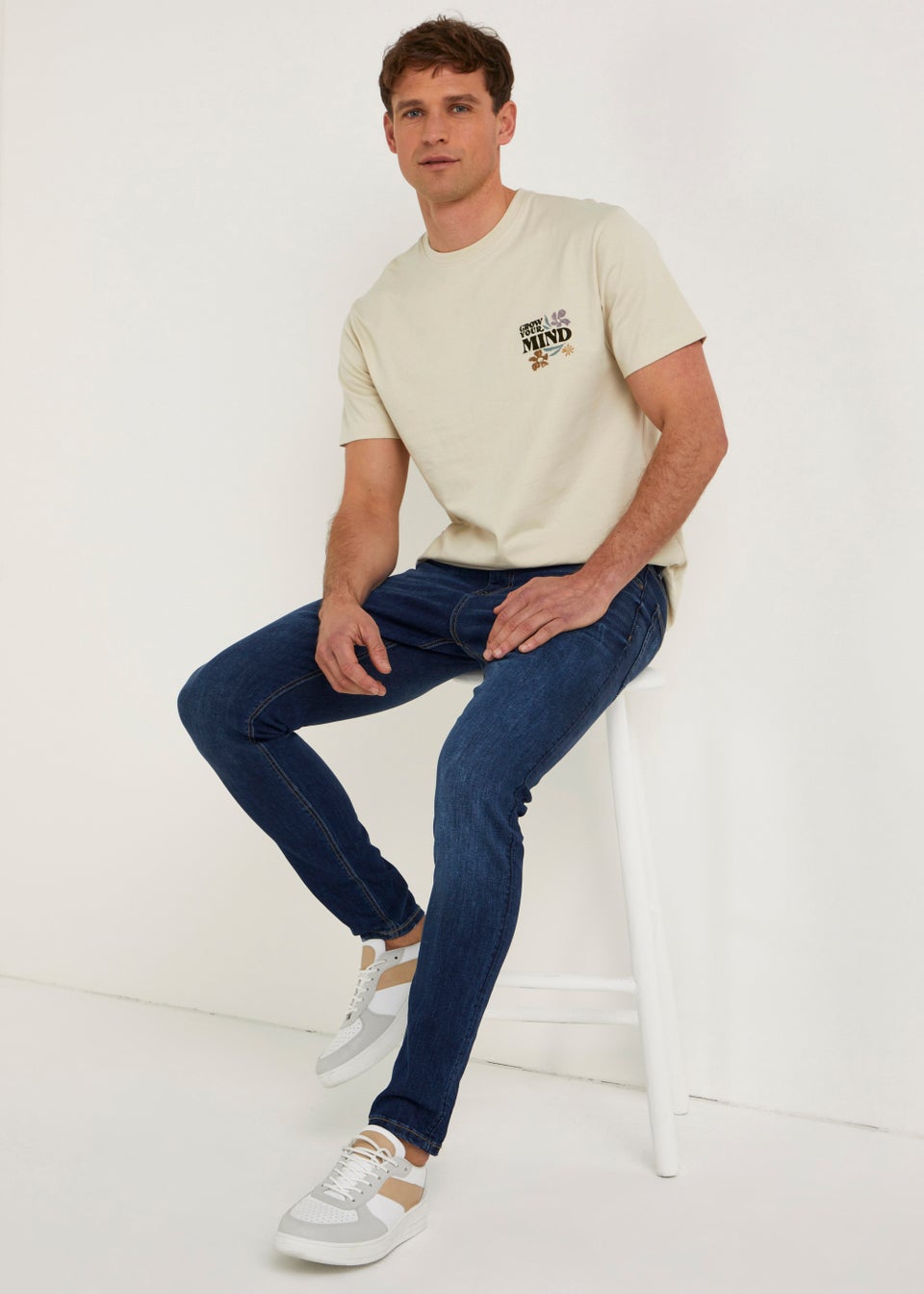 Cream shirt and blue jeans store