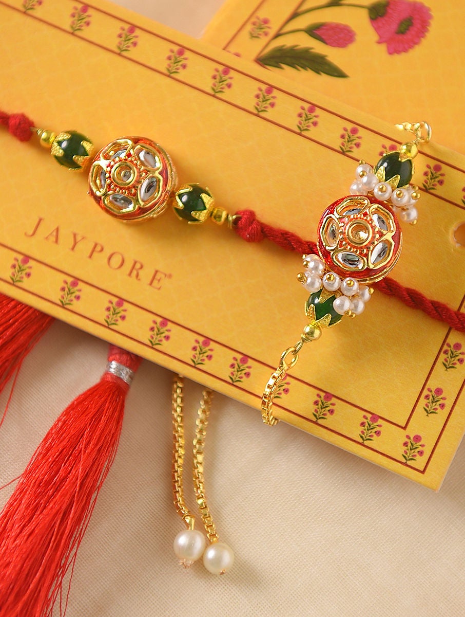 Women Red Handcrafted Kundan Rakhi With Green Red Lumba (Set Of 2)