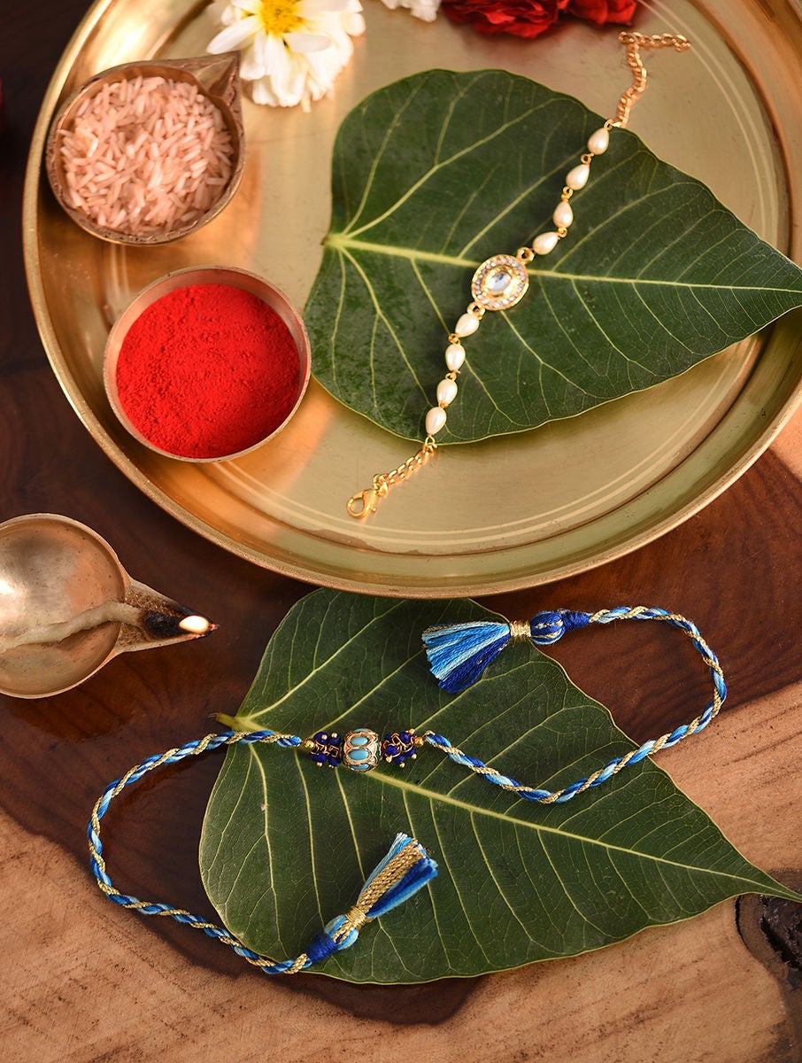 Women Kundan Handcrafted Rakhi With Lumba In A Gift Box (Set Of 2)