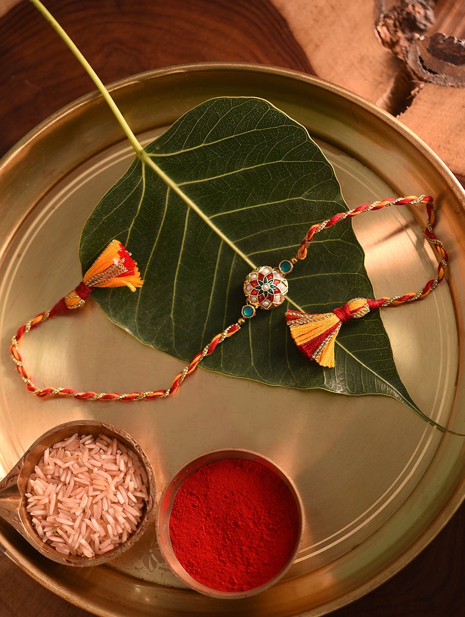 Women Gold Tone Handcrafted Enamel Rakhi In A Gift Box