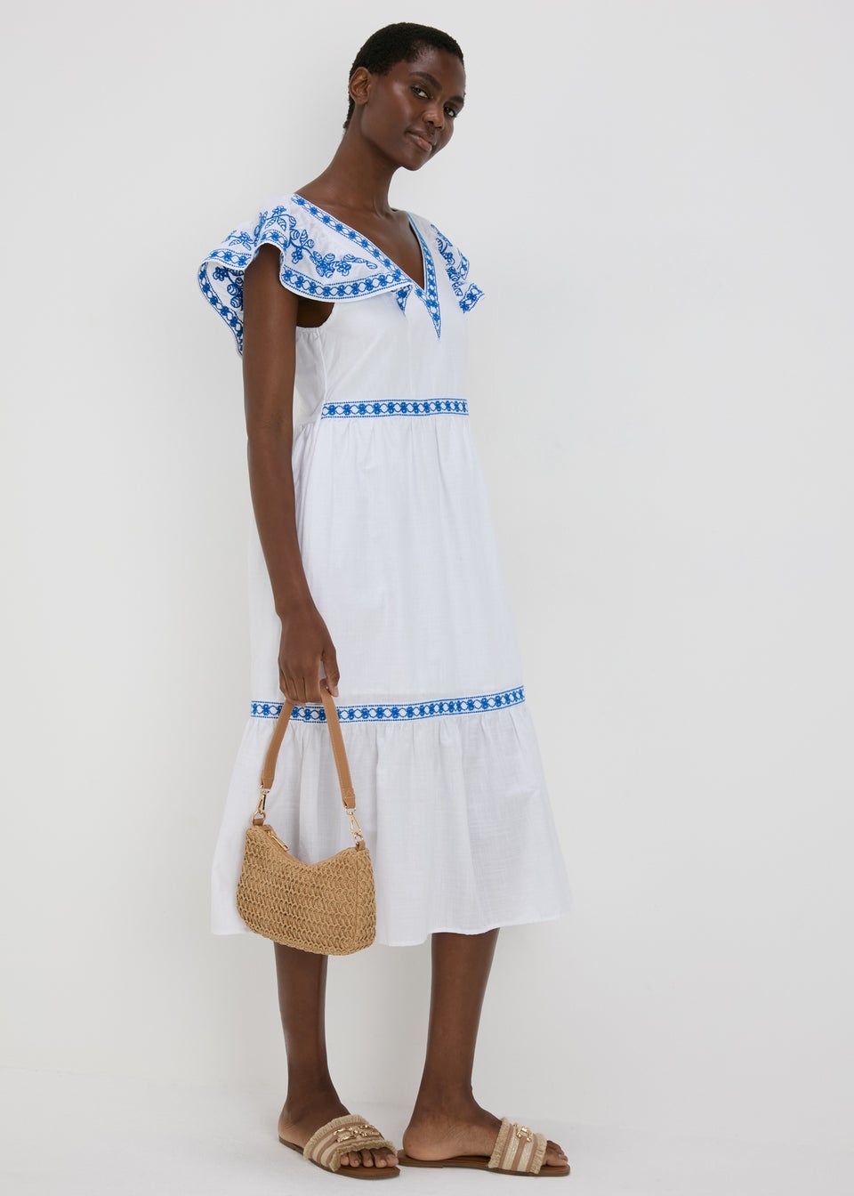 White dress with blue embroidery new arrivals