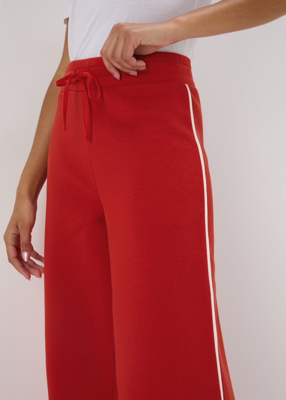 Womens red joggers with white stripe 2025