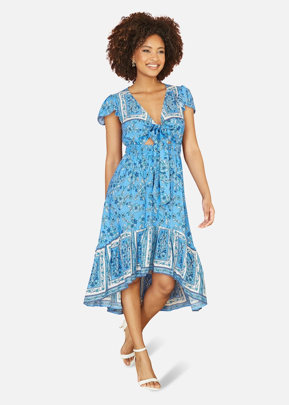 Mela Blue Ditsy Print Sun Dress With Cross Over Back Tie Front And Dip Hem