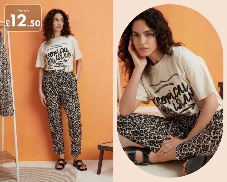 Woman wearing leopard print jersey trousers paired with a graphic t shirt and black sandals.​