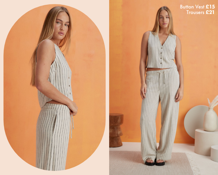 Woman wearing a cream and black pinstripe matching set with a waistcoat and pair of wide leg trousers. The co ord is worn by itself but paired with some chunky slip on sandals.​