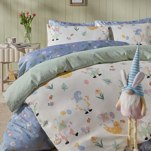 Bed dressed with Gonk themed Easter bedding with an Easter Gonk ornament.
