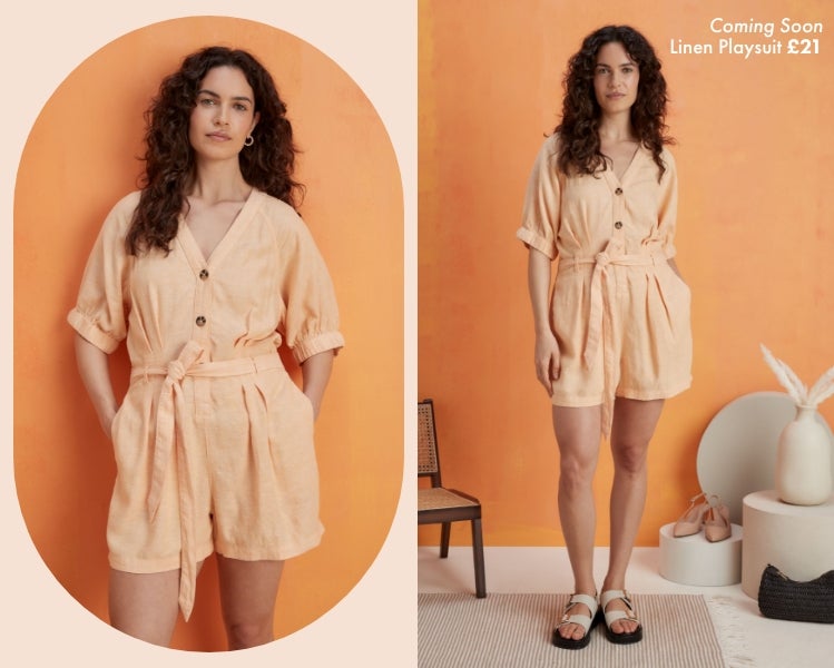 Woman wearing peach coloured linen playsuit with tie belt detailing and cream mule sandals.​