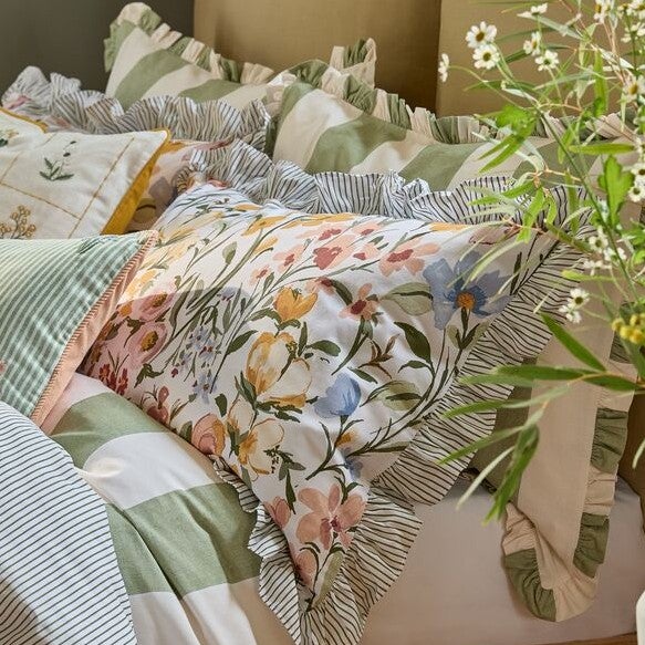 Bed dressed with Gonk themed Easter bedding with an Easter Gonk ornament.